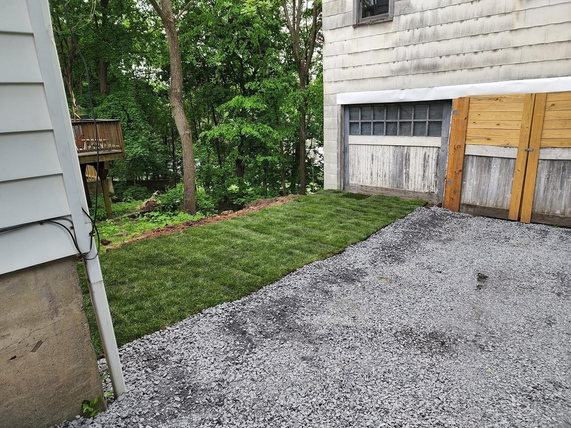 Fresh sod and stone-edge install along side yard