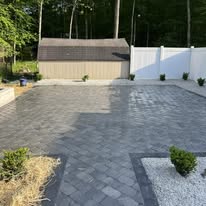 Finished paver driveway with bordered plantings